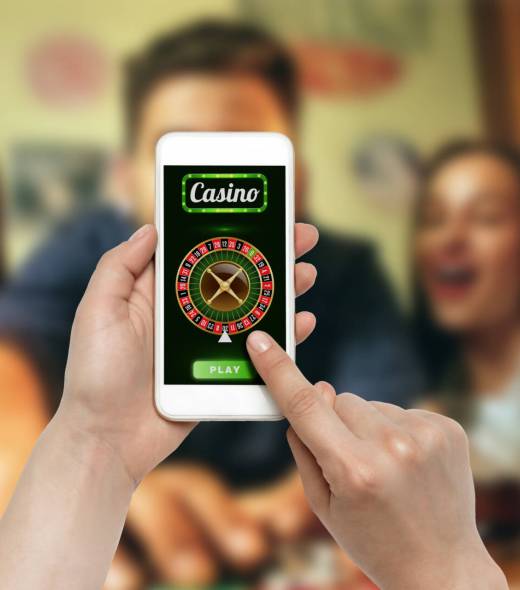 Online gambling, casino concept. Hand holding device with lottery, casino cover